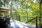 Furnished deck with quiet wooded setting